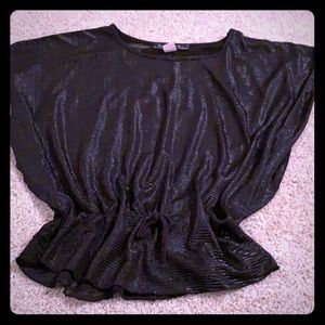 Black shirt with some back showing.